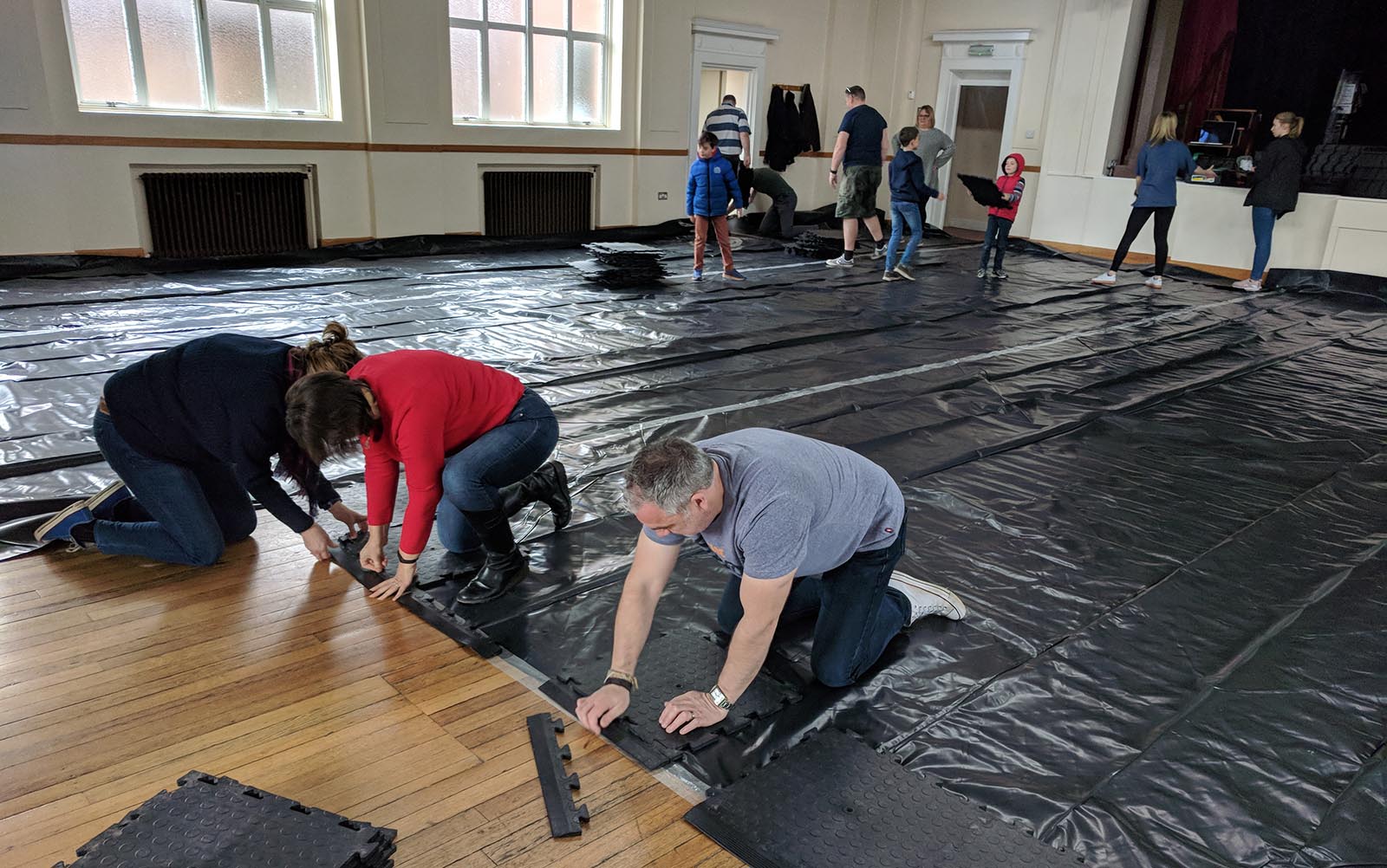 Laying tiles in the new home of Bournemouth Foodbank